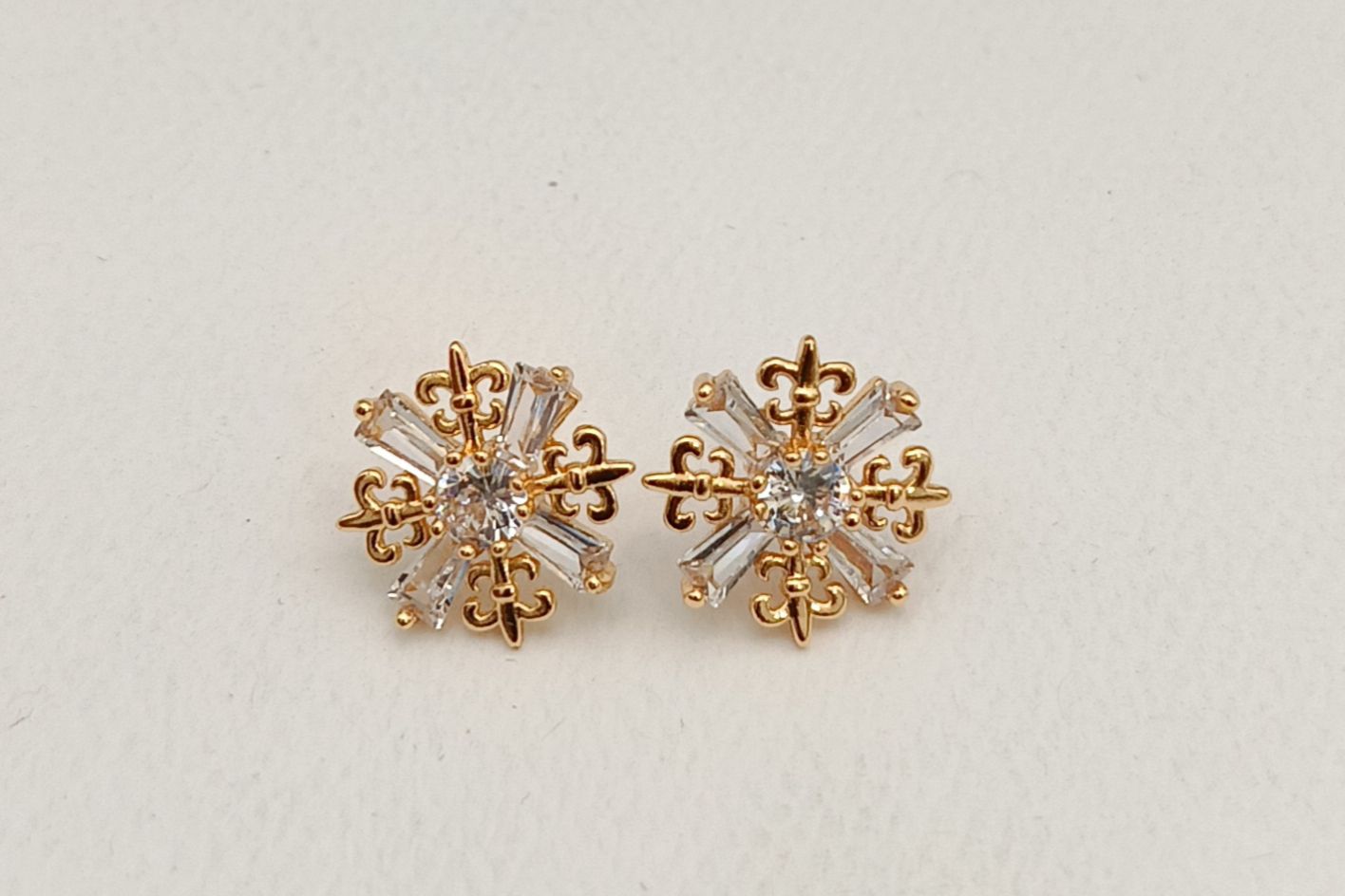 Star shaped beautiful golden ear stud with AD work